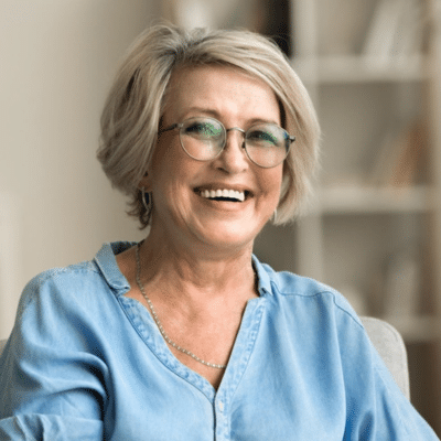 A woman smiling at camera, representing cosmetic dentistry in yorktown va