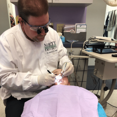 Dr. Anthony martin working on a patient's teeth, representing gingivitis treatment in yorktown va